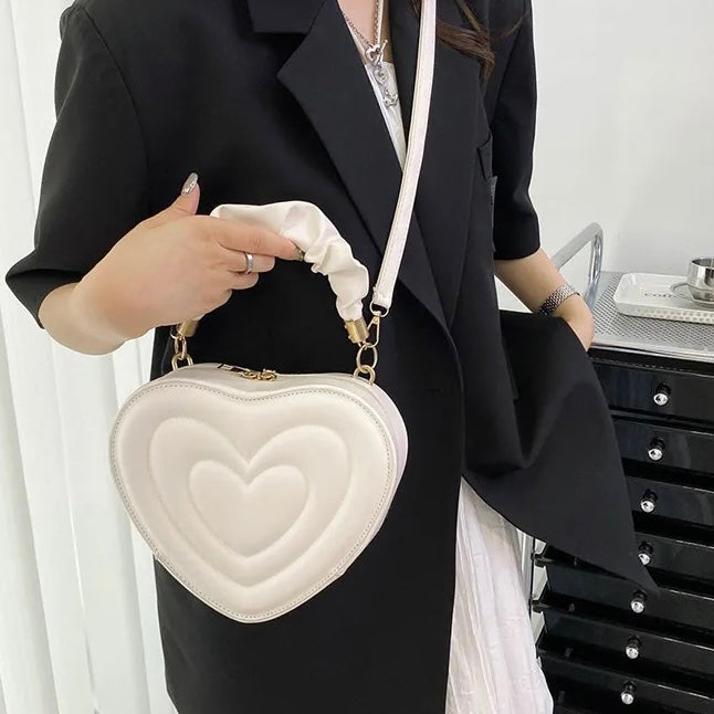 Small heart shaped handbag with detachable crossbody strap